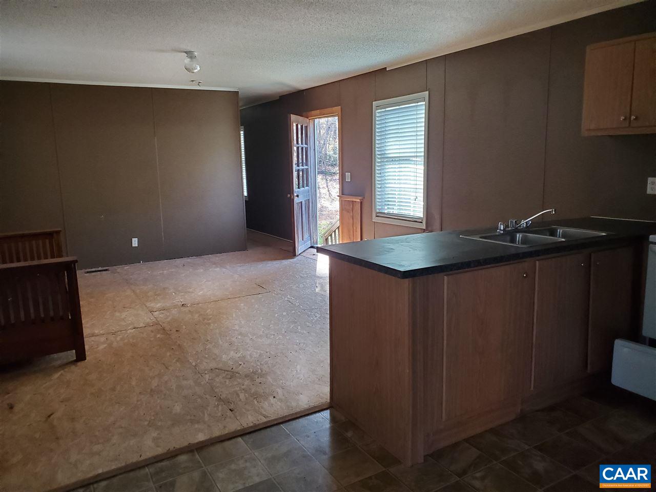 3454 Firehouse Road Howardsville, VA 24562 - Photo 5 of 9 an empty room with kitchen appliances