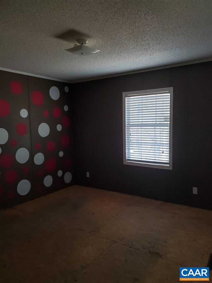 3454 Firehouse Road Howardsville, VA 24562 - Photo 8 of 9 a living room with windows