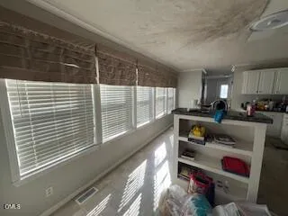 a kitchen with a sink and a refrigerator