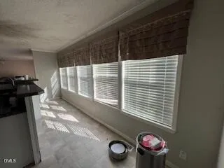 a view of a door and a window