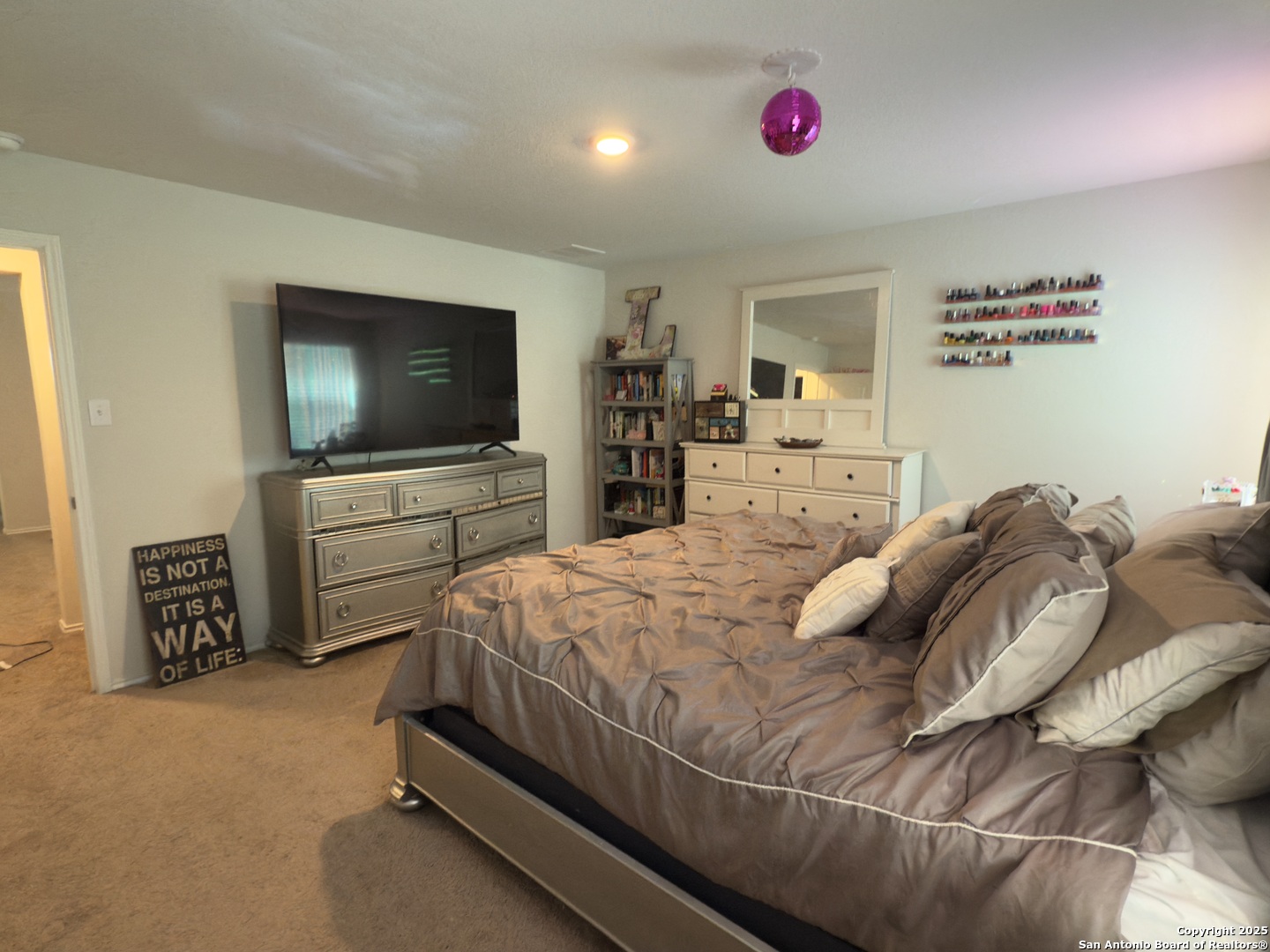 4002 Winterfell Pass Converse, TX 78109 - Photo 25 of 35 a bedroom with a bed and a flat screen tv