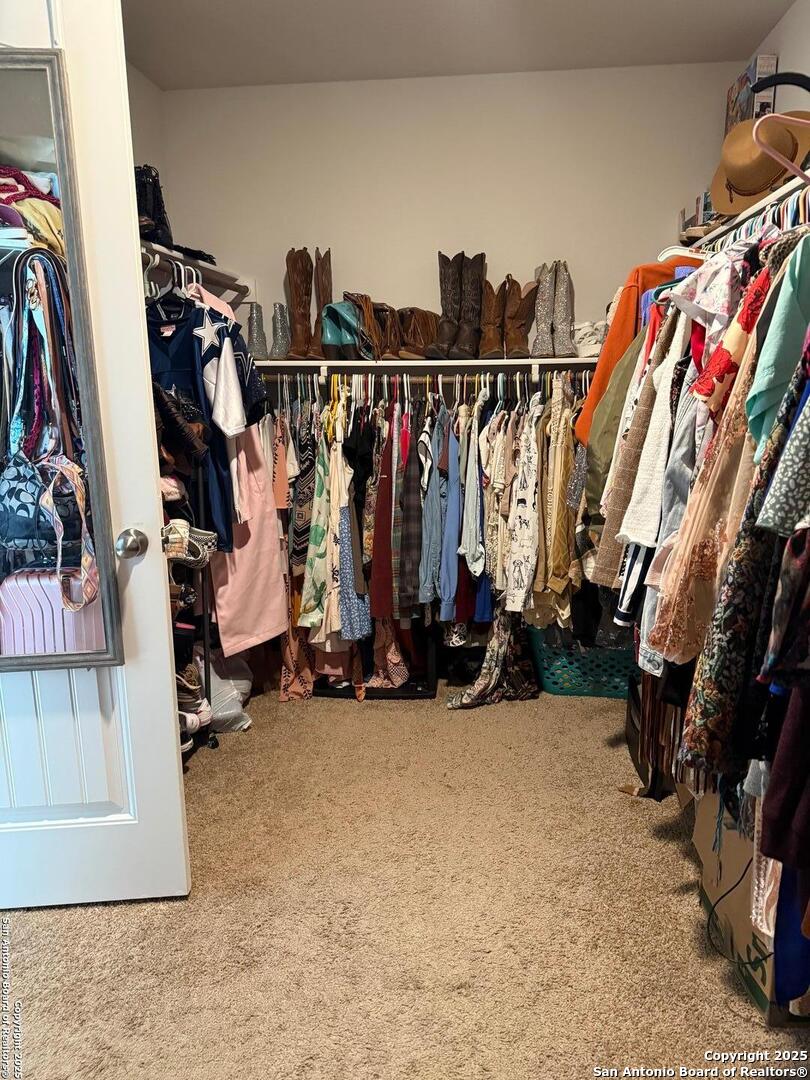 4002 Winterfell Pass Converse, TX 78109 - Photo 28 of 35 a view of walk in closet with clothes