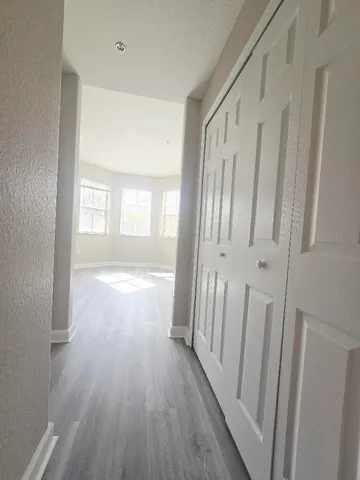a view of entryway with wooden floor