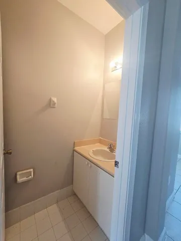 a bathroom with a sink and mirror