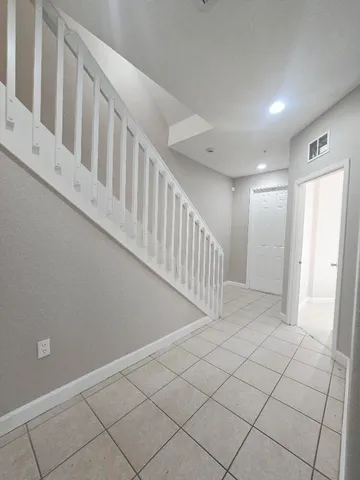 a view of a backyard of the house