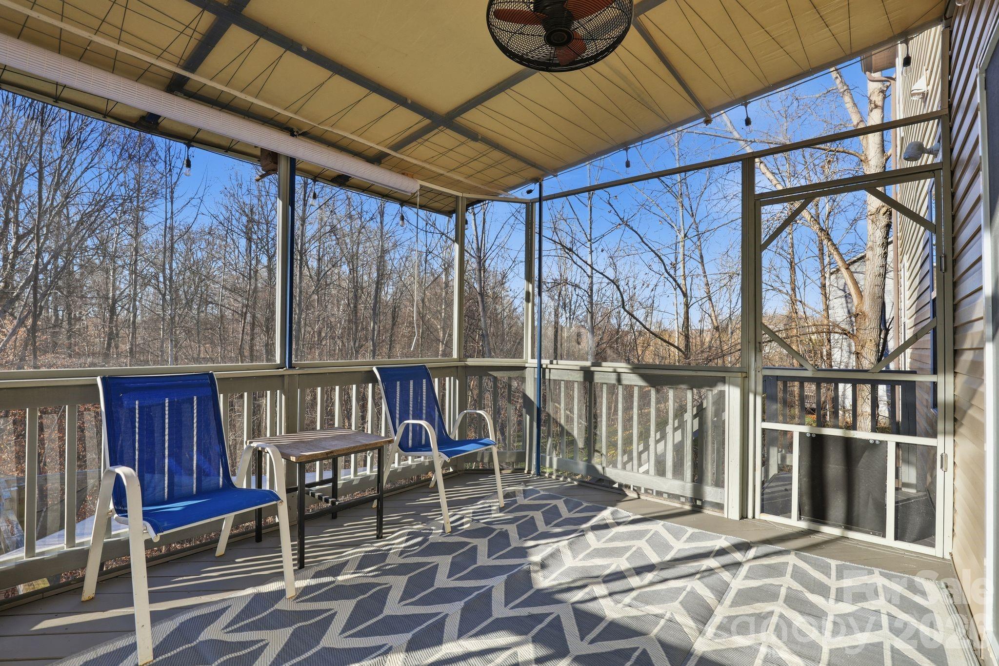 7532 West Berkeley Road, Unit 25 Denver, NC 28037 - Photo 12 of 36 a view of a chairs with wooden fence