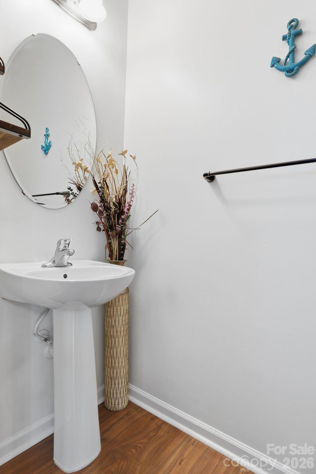 7532 West Berkeley Road, Unit 25 Denver, NC 28037 - Photo 13 of 36 a bathroom with a sink and a mirror