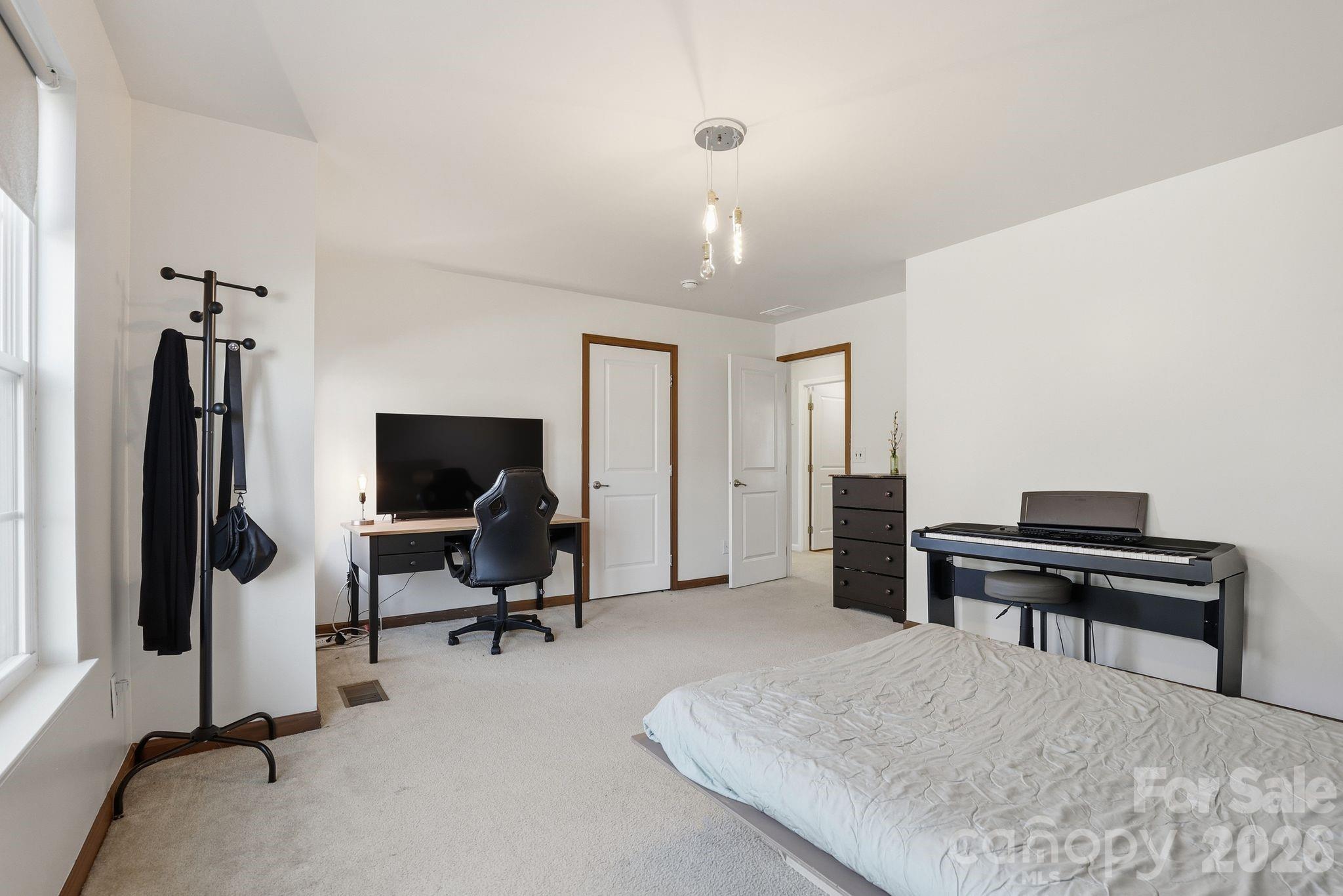 7532 West Berkeley Road, Unit 25 Denver, NC 28037 - Photo 25 of 36 a view of a livingroom with workspace and a couch
