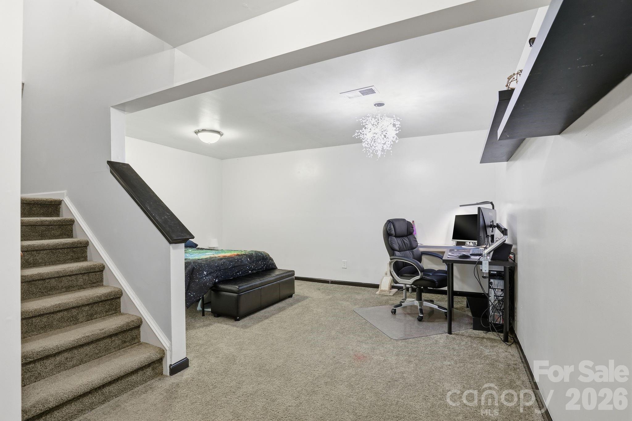 7532 West Berkeley Road, Unit 25 Denver, NC 28037 - Photo 26 of 36 a workspace with wooden floor and furniture