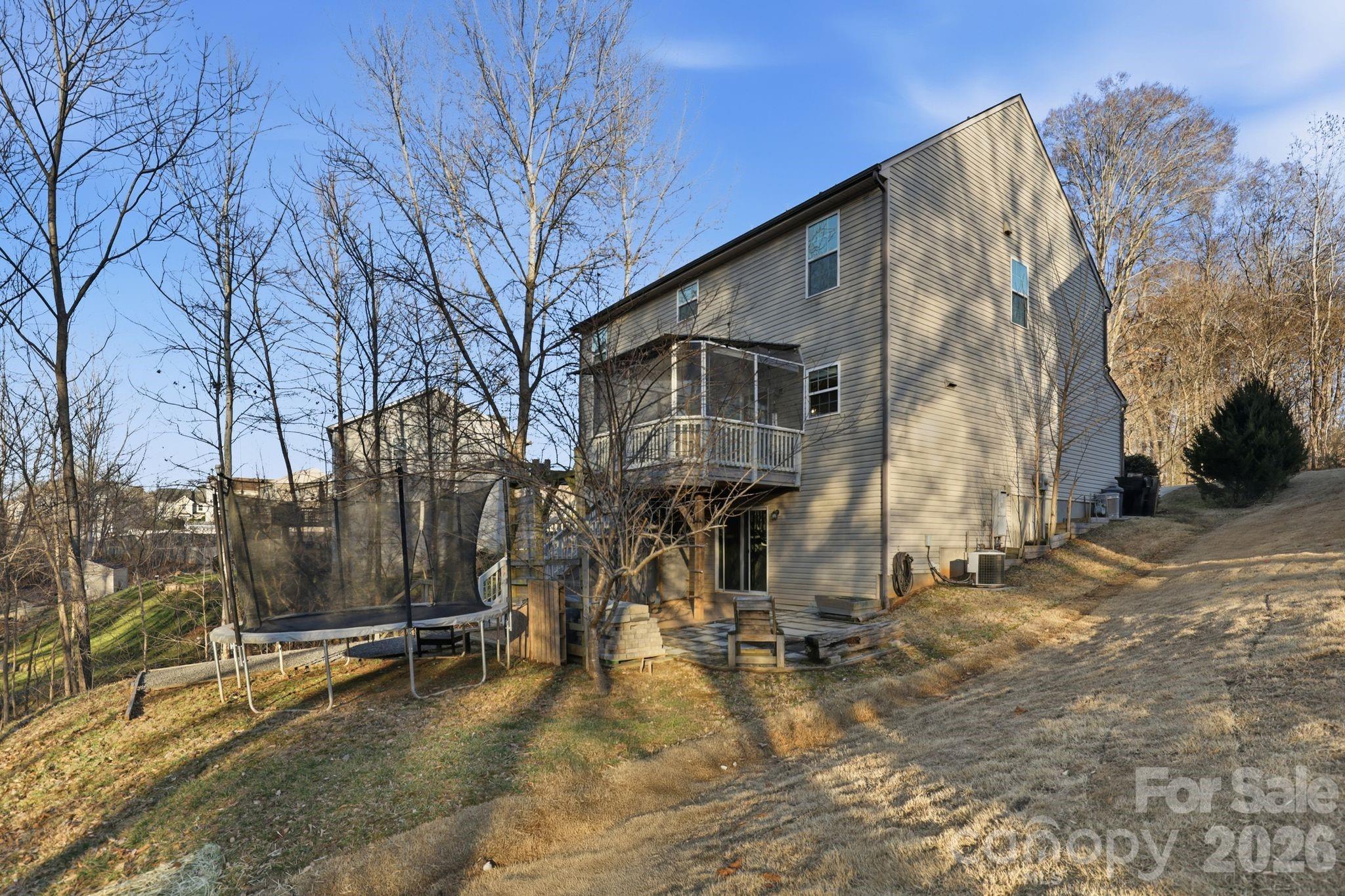 7532 West Berkeley Road, Unit 25 Denver, NC 28037 - Photo 33 of 36 a view of a house with snow on the road