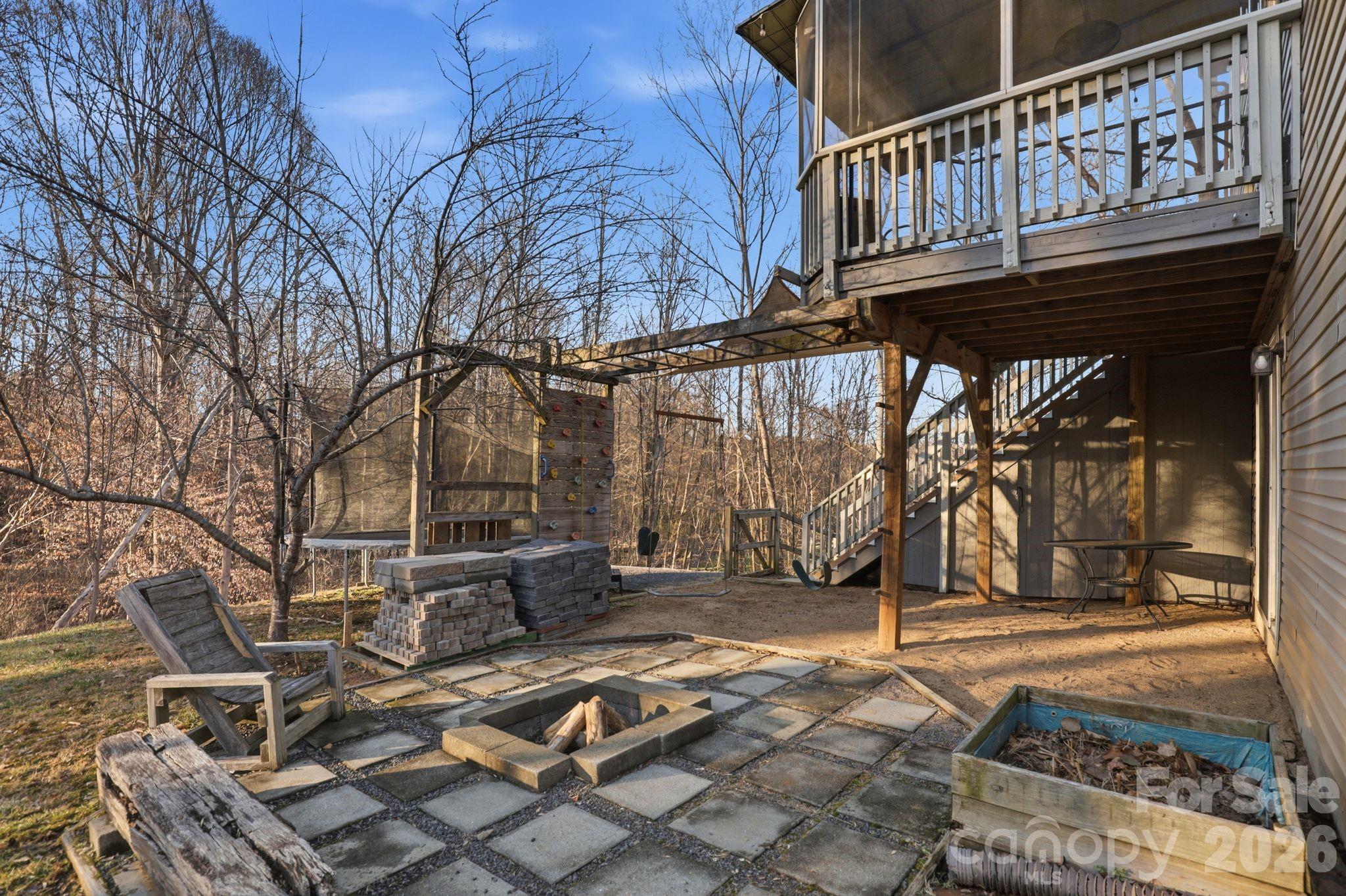 7532 West Berkeley Road, Unit 25 Denver, NC 28037 - Photo 36 of 36 a backyard of a house with barbeque oven table and chairs
