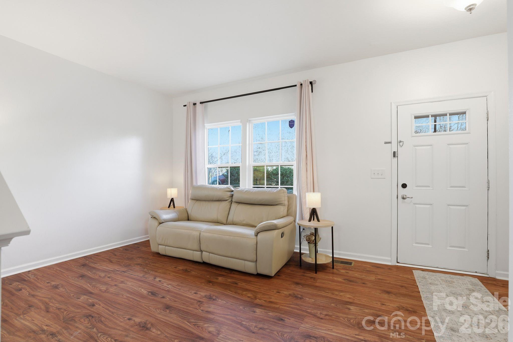 7532 West Berkeley Road, Unit 25 Denver, NC 28037 - Photo 5 of 36 a living room with furniture and a window