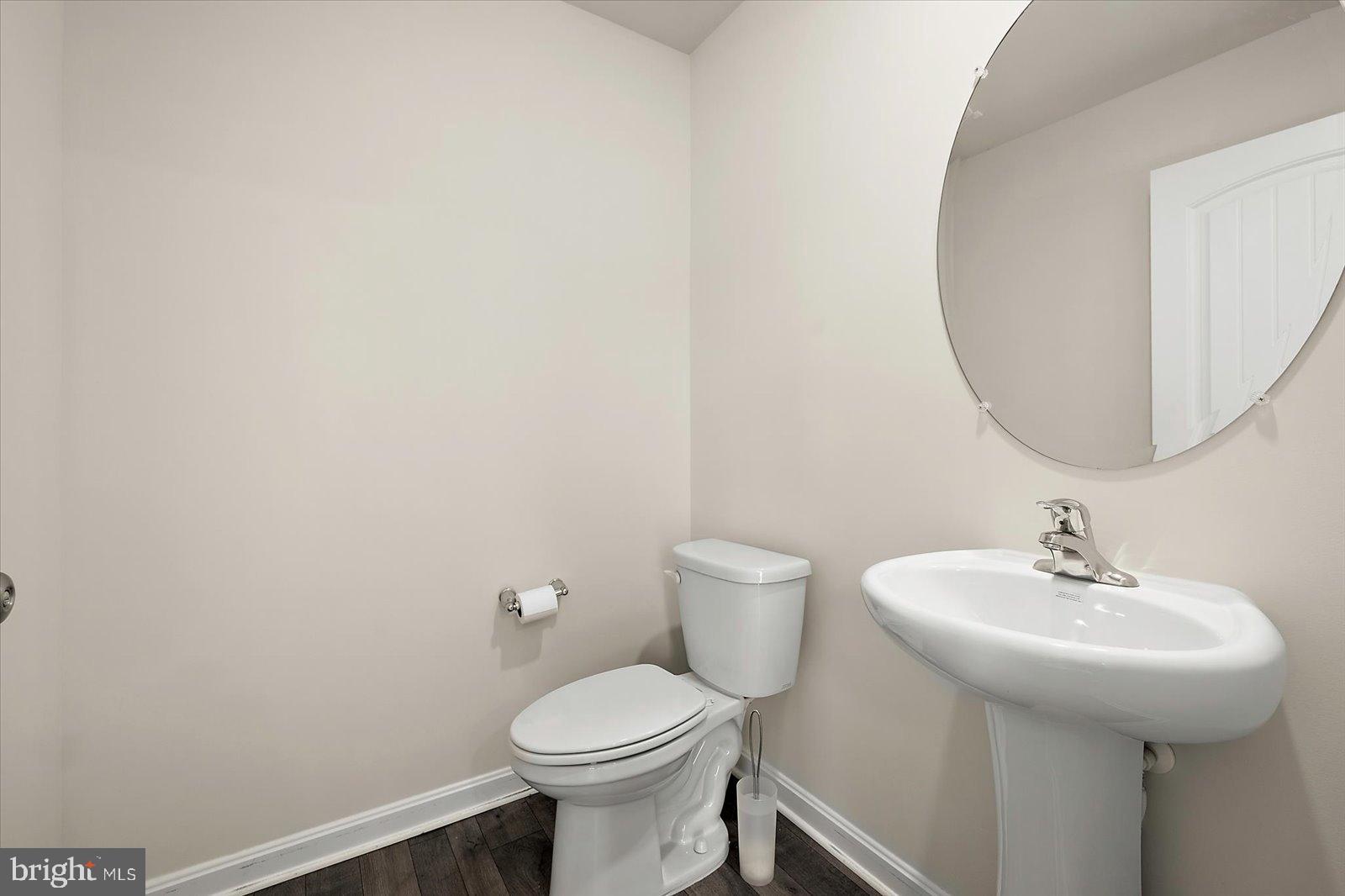 3 Orchard Road Seaford, DE 19973 - Photo 14 of 45 a bathroom with a sink a toilet and mirror