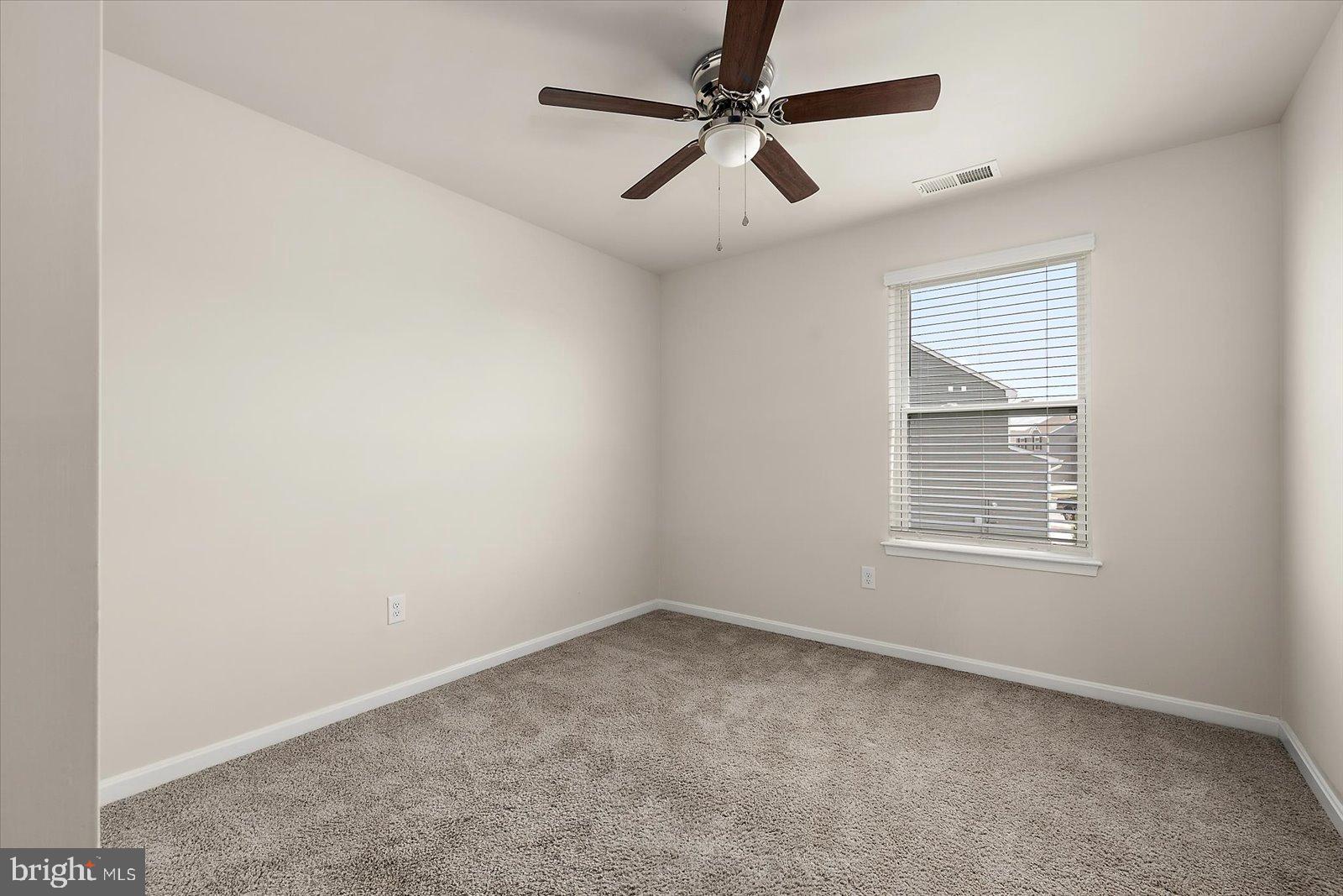 3 Orchard Road Seaford, DE 19973 - Photo 17 of 45 an empty room with a window and a fan