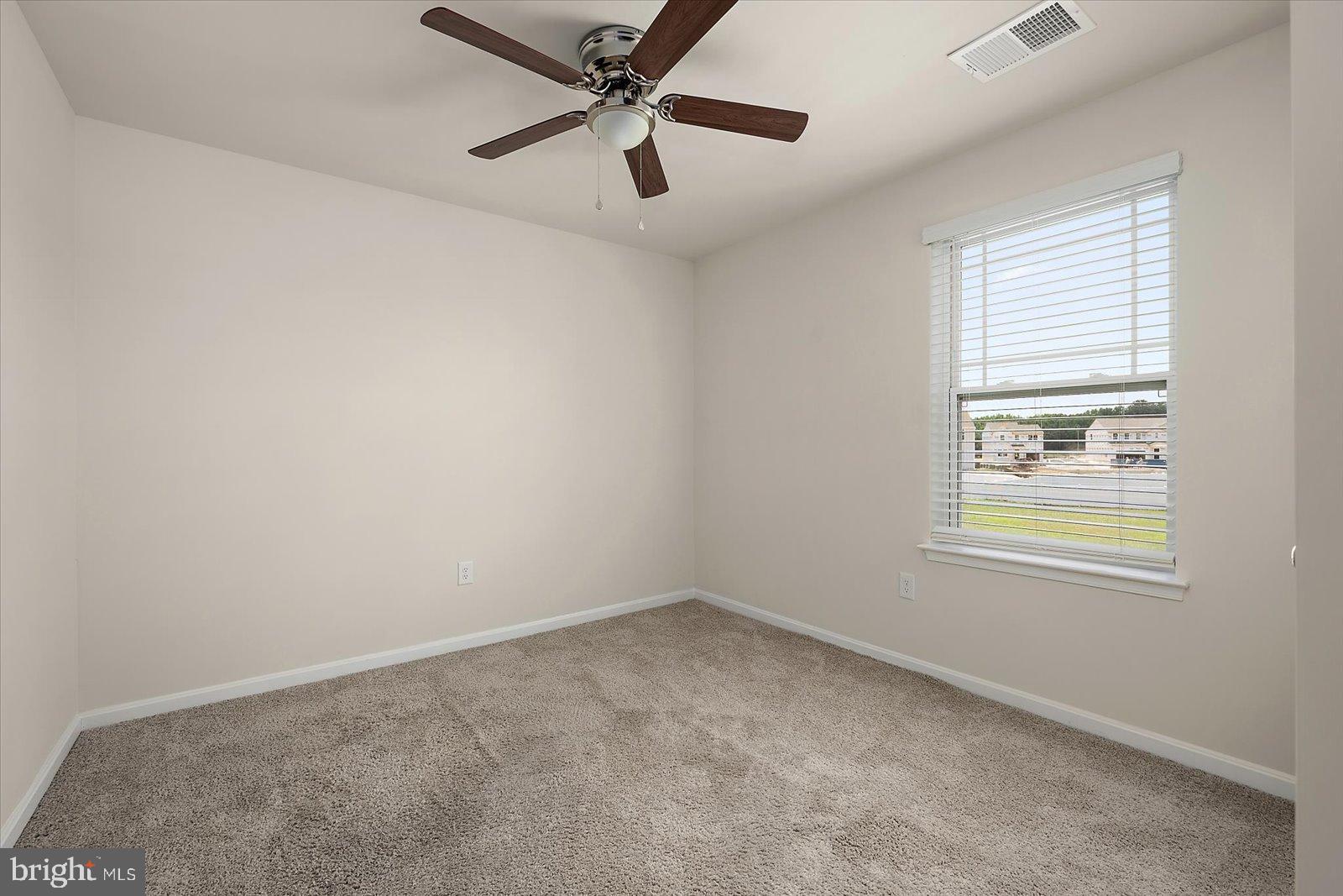 3 Orchard Road Seaford, DE 19973 - Photo 22 of 45 an empty room with a window and a fan