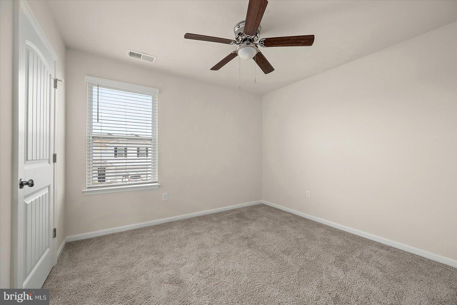 3 Orchard Road Seaford, DE 19973 - Photo 26 of 45 an empty room with a window and a fan