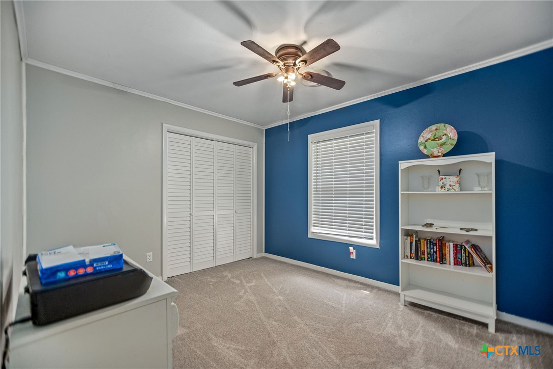 519 Travis Street Port Lavaca, TX 77979 - Photo 18 of 26 a living room with furniture and a window