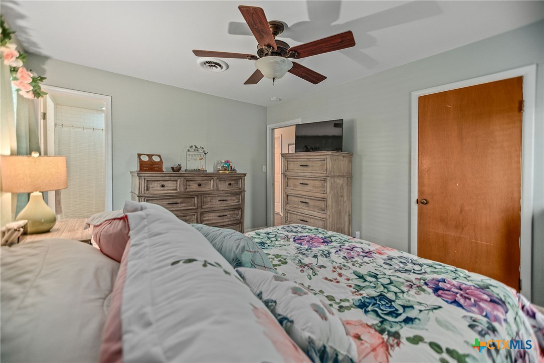 519 Travis Street Port Lavaca, TX 77979 - Photo 20 of 26 a bedroom with a bed and dresser