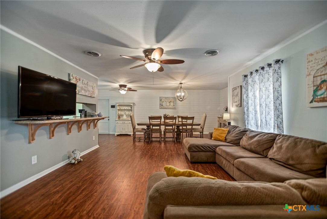 519 Travis Street Port Lavaca, TX 77979 - Photo 4 of 26 a living room with furniture and a flat screen tv