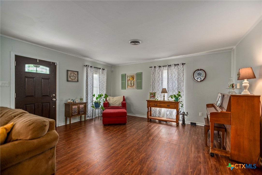 519 Travis Street Port Lavaca, TX 77979 - Photo 5 of 26 a living room with furniture and wooden floor