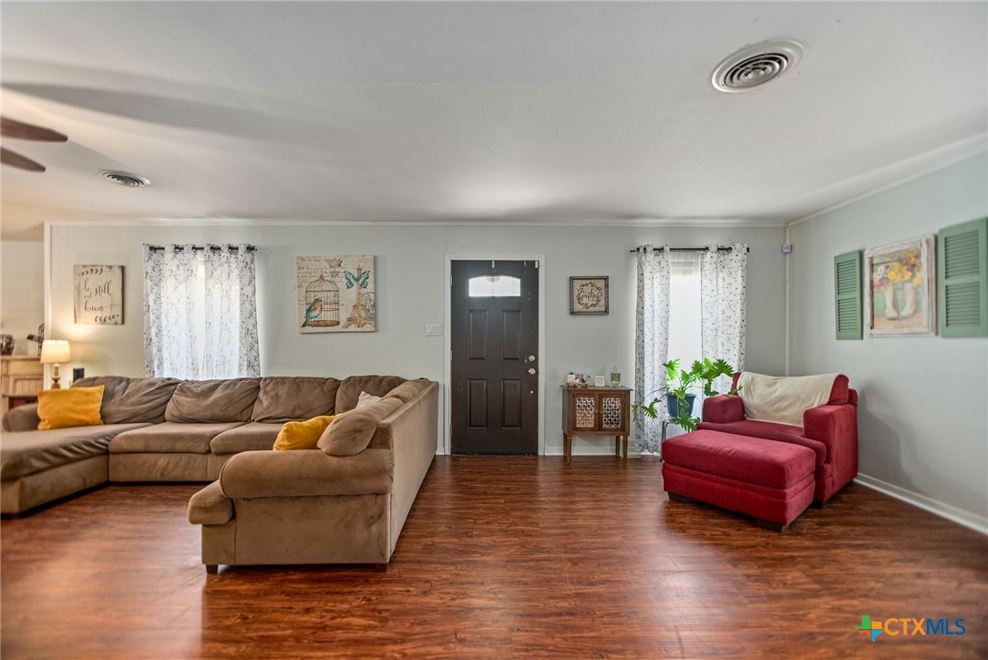 519 Travis Street Port Lavaca, TX 77979 - Photo 6 of 26 a living room with furniture and wooden floor