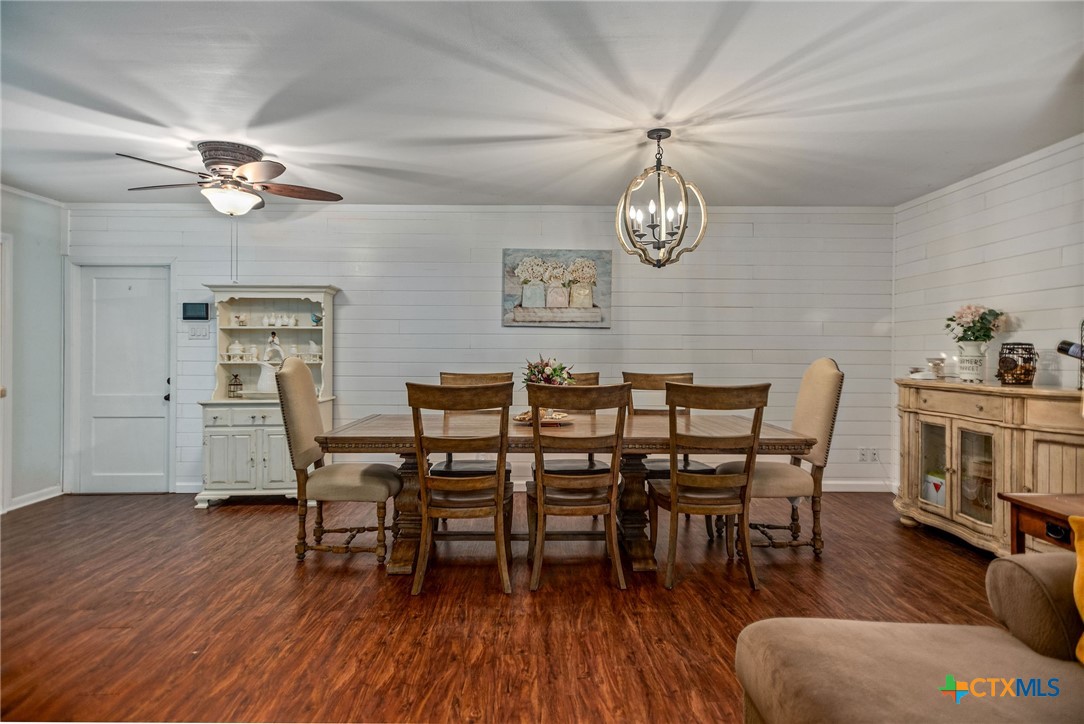 519 Travis Street Port Lavaca, TX 77979 - Photo 7 of 26 a view of a dining room with furniture wooden floor and chandelier