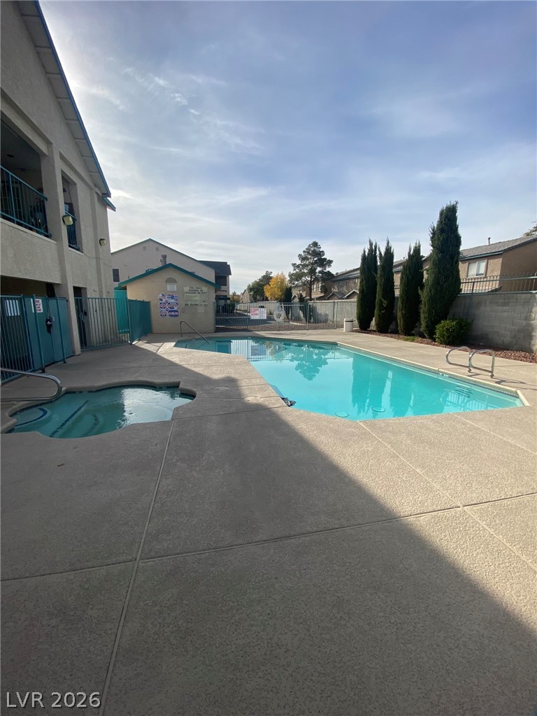5271 South Lindell Road, Unit 202 Las Vegas, NV 89118 - Photo 27 of 27 An inviting pool and spa area awaits, perfect for relaxation and recreation.
