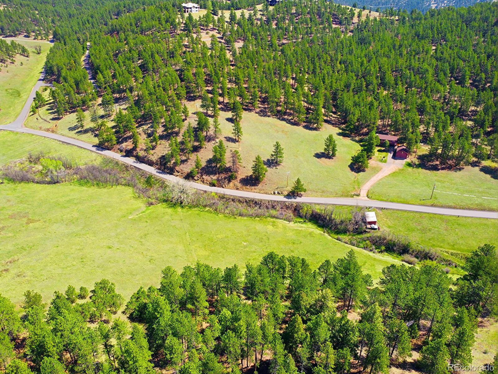 2830 Kerr Gulch Road Evergreen, CO 80439 - Photo 43 of 48 a view of a yard with an outdoor space