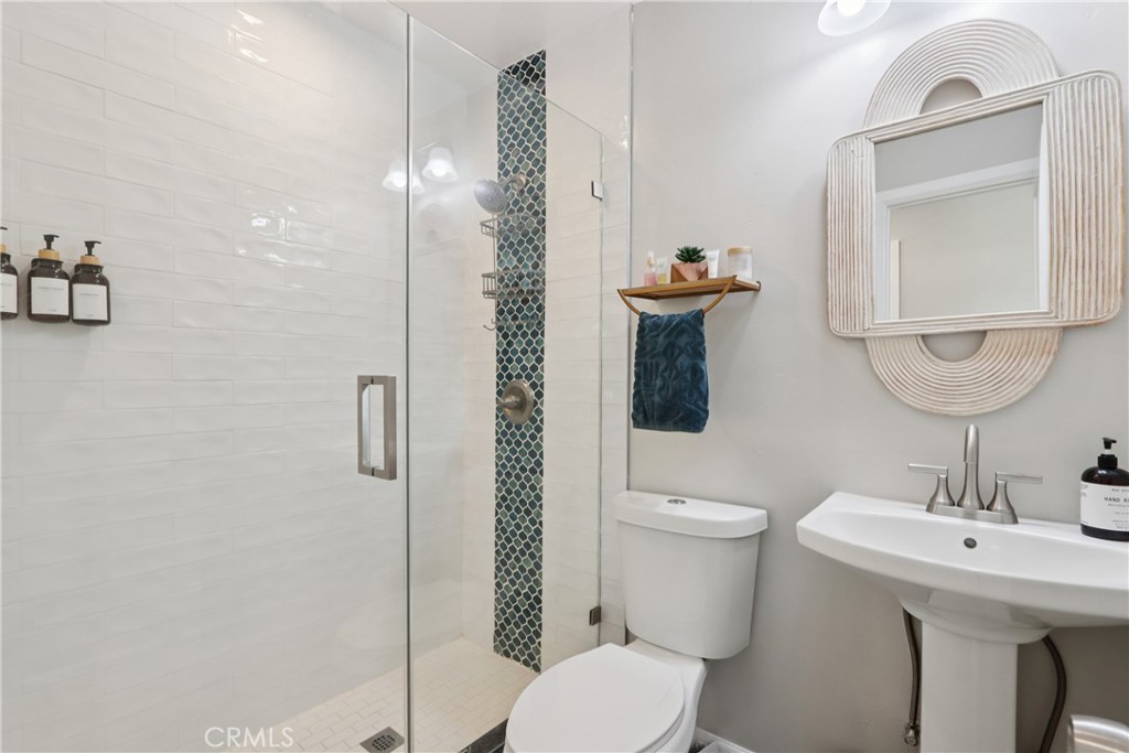 5235 Border Avenue Joshua Tree, CA 92252 - Photo 16 of 63 a bathroom with a sink a toilet and shower