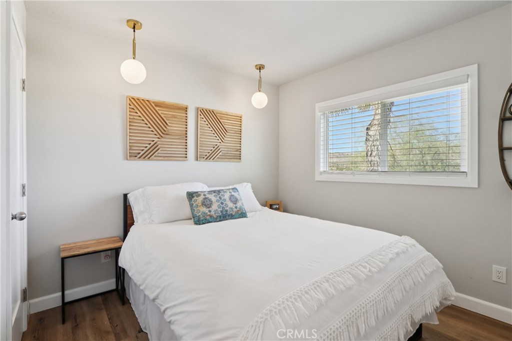 5235 Border Avenue Joshua Tree, CA 92252 - Photo 17 of 63 a bedroom with a bed and a window