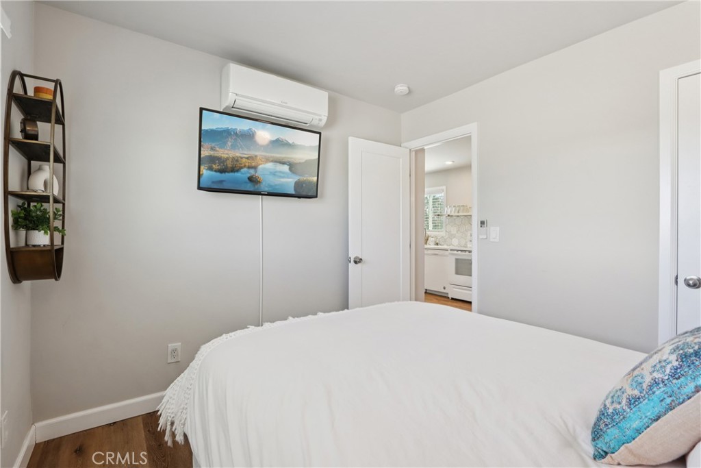 5235 Border Avenue Joshua Tree, CA 92252 - Photo 19 of 63 a bedroom with a bed and a wall painting
