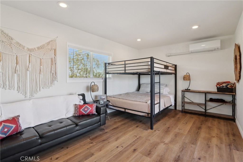 5235 Border Avenue Joshua Tree, CA 92252 - Photo 23 of 63 a bedroom with furniture and a window