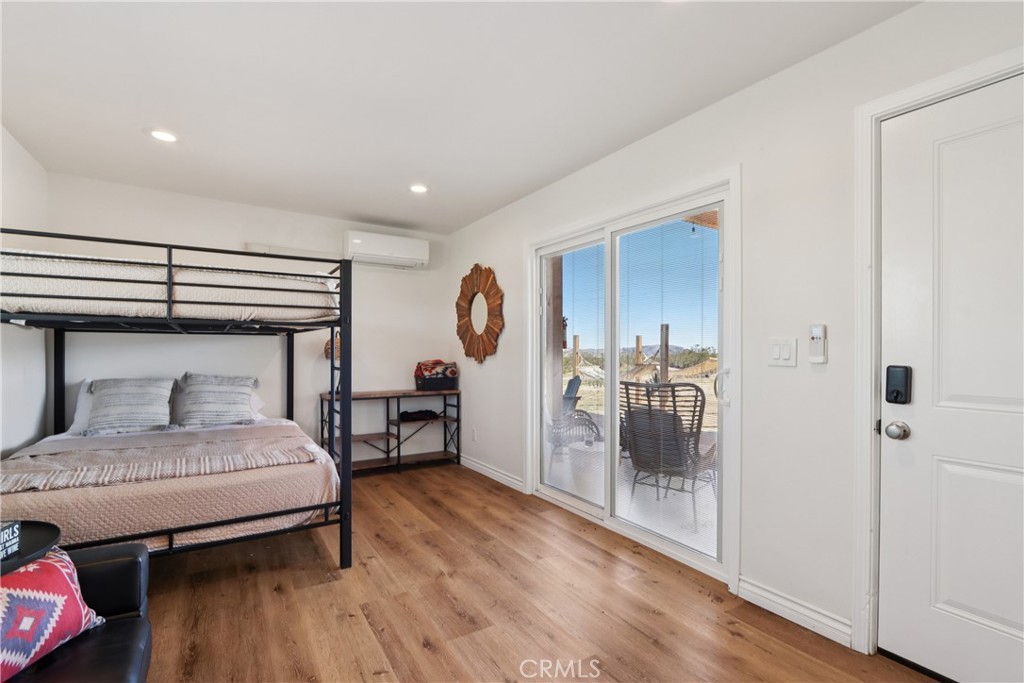 5235 Border Avenue Joshua Tree, CA 92252 - Photo 24 of 63 a bedroom with a bed and a table