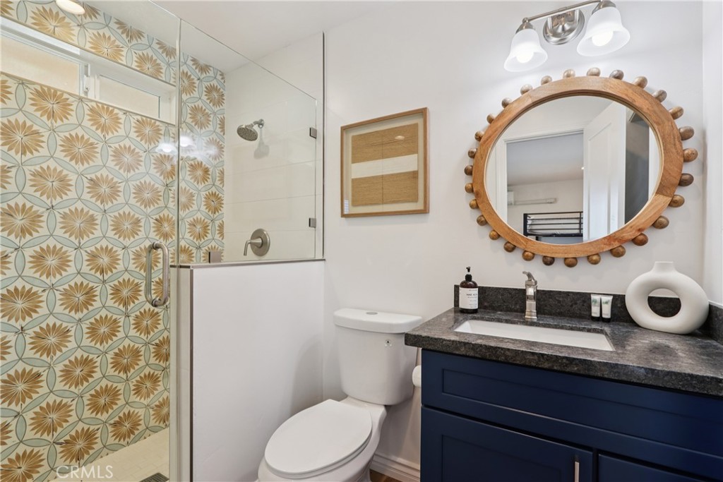 5235 Border Avenue Joshua Tree, CA 92252 - Photo 27 of 63 a bathroom with a sink a toilet and a mirror