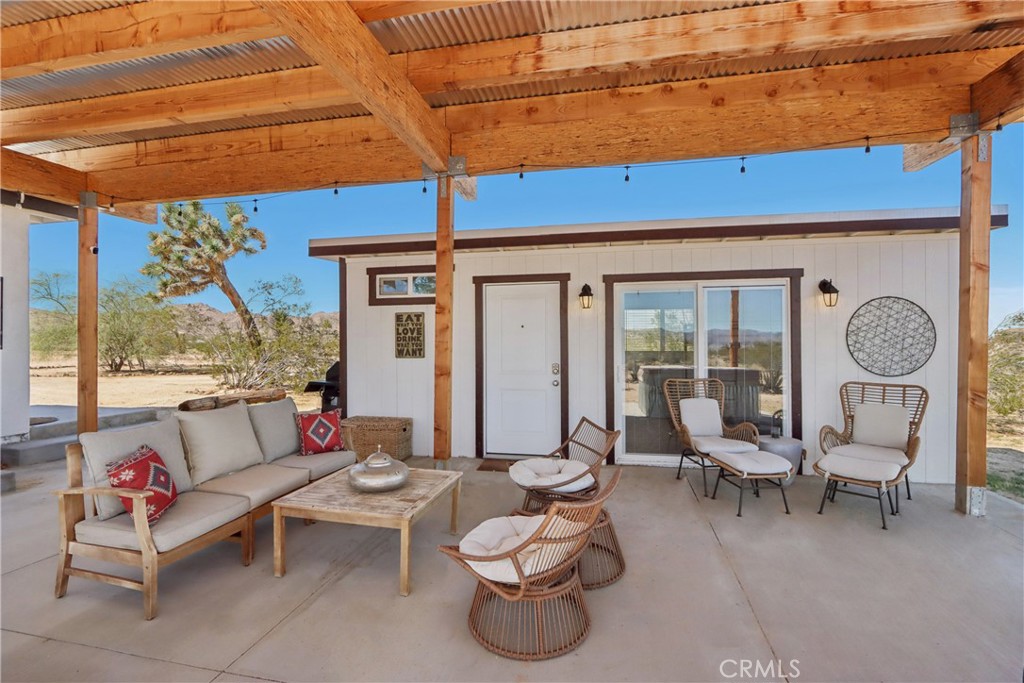 5235 Border Avenue Joshua Tree, CA 92252 - Photo 30 of 63 a building outdoor space with patio furniture and potted plants