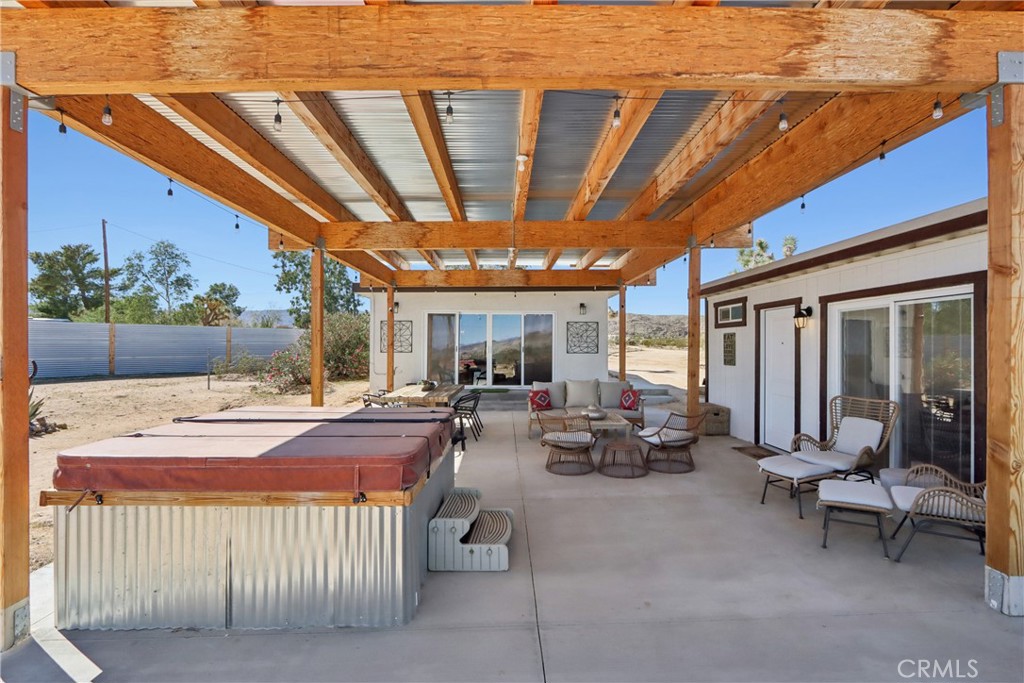 5235 Border Avenue Joshua Tree, CA 92252 - Photo 31 of 63 a view of a house with sitting area and furniture