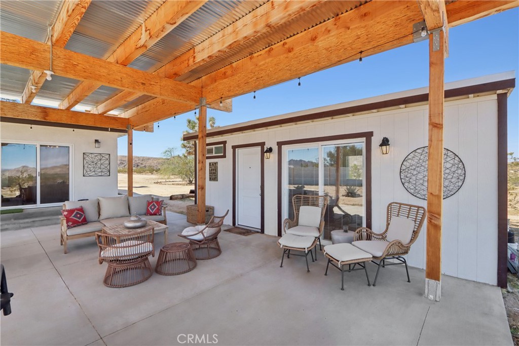 5235 Border Avenue Joshua Tree, CA 92252 - Photo 36 of 63 a building outdoor space with patio furniture and potted plants
