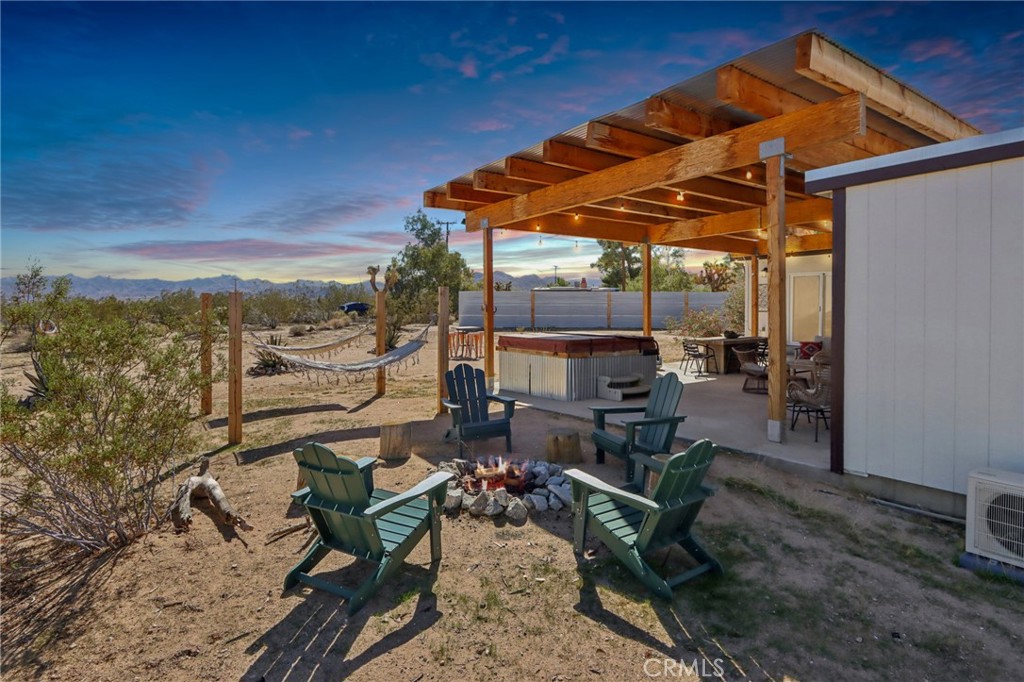 5235 Border Avenue Joshua Tree, CA 92252 - Photo 4 of 63 a view of a backyard with sitting area