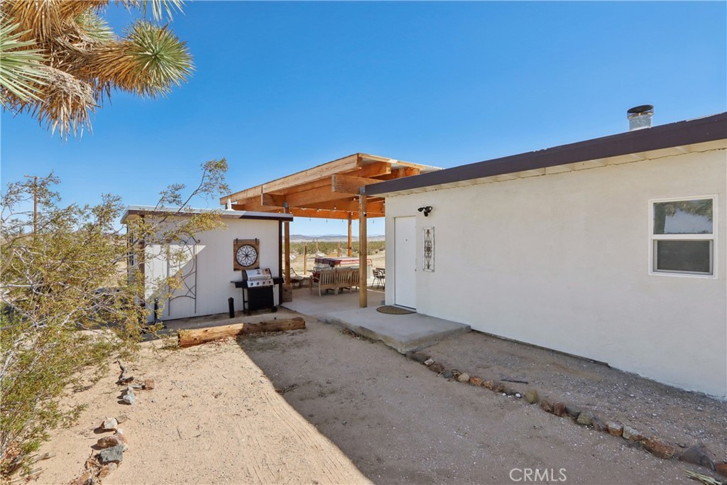 5235 Border Avenue Joshua Tree, CA 92252 - Photo 43 of 63 a backyard of a house with seating space