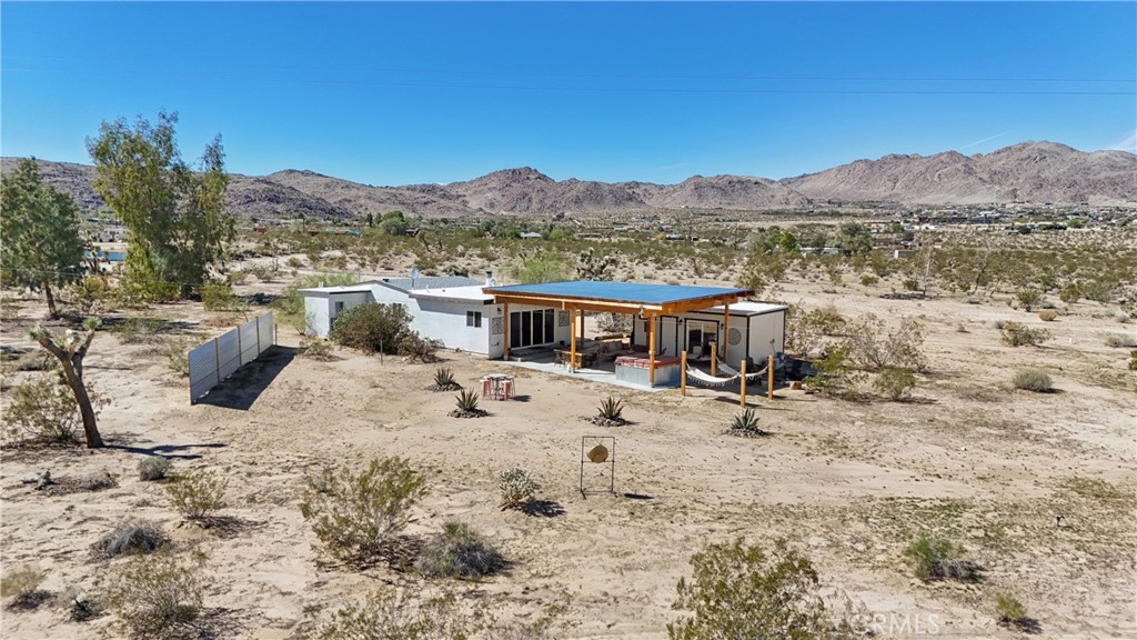 5235 Border Avenue Joshua Tree, CA 92252 - Photo 57 of 63 a view of a terrace with a mountain