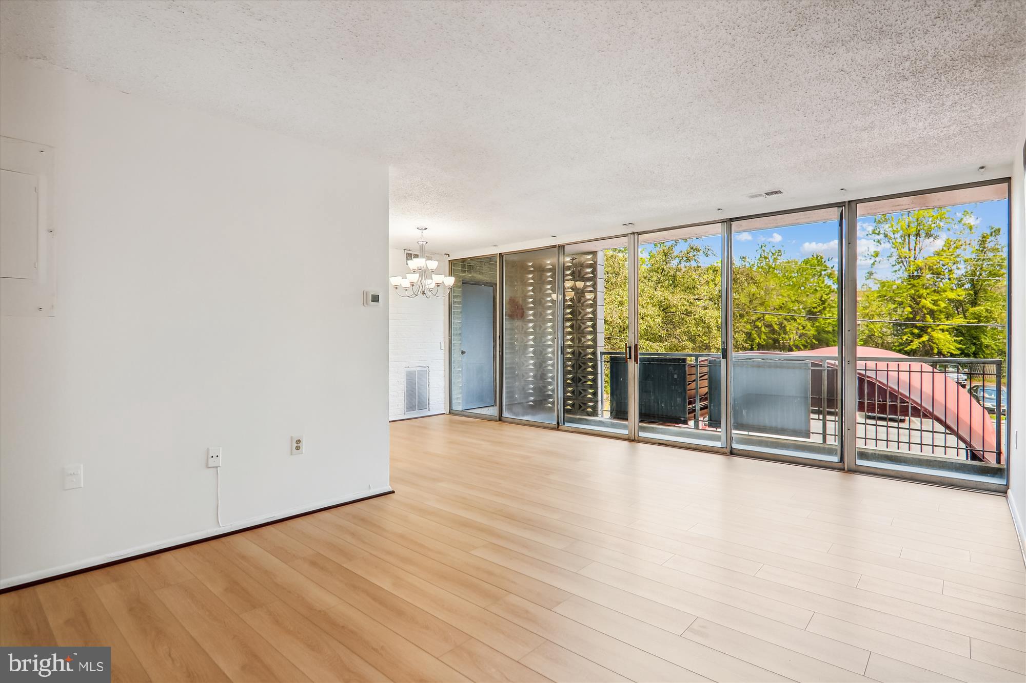 1826 Metzerott Road, Unit 207 Adelphi, MD 20783 - Photo 7 of 26 New Flooring & Exit to Large Balcony
