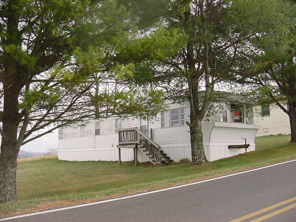 360 Wills Ridge Road Northwest Floyd, VA 24091 - Photo 2 of 6 a view of a house with a yard