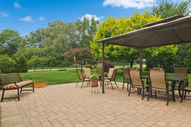 an outdoor space with furniture and umbrella