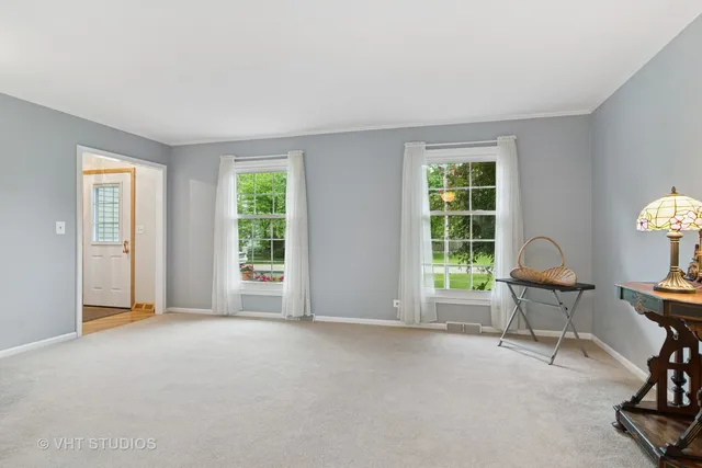 a view of a livingroom with furniture and a window