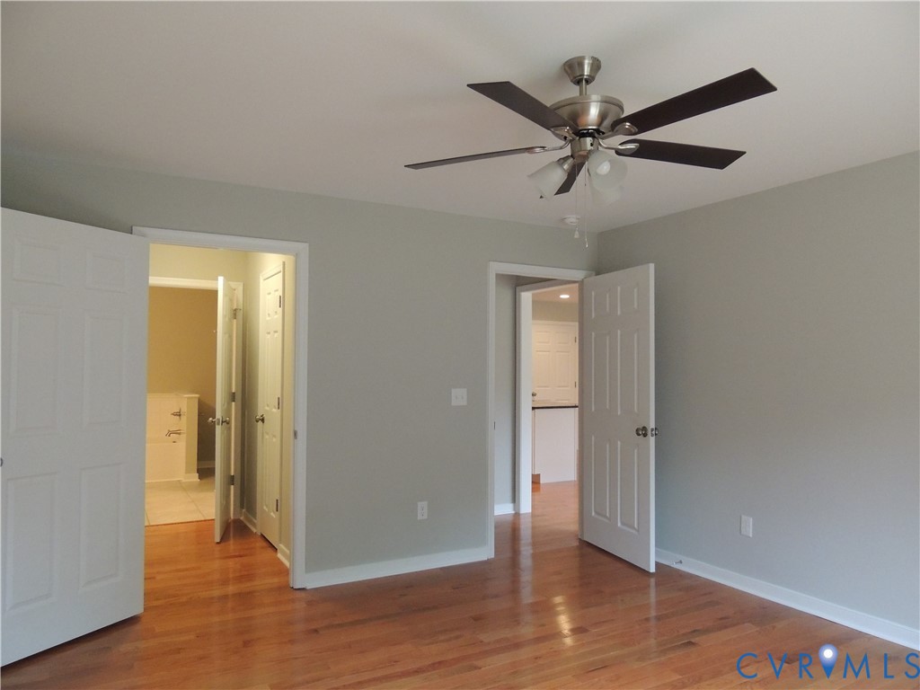 4417 Olgers Road Sutherland, VA 23885 - Photo 13 of 24 Primary bedroom View to primary bath with wood-fin