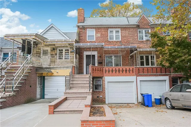 a front view of a house with a garage