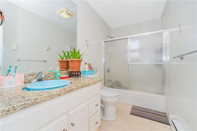 a bathroom with a sink toilet and tub