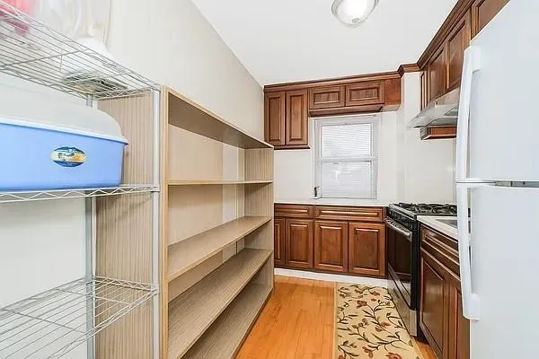a kitchen with stainless steel appliances granite countertop a stove and a refrigerator