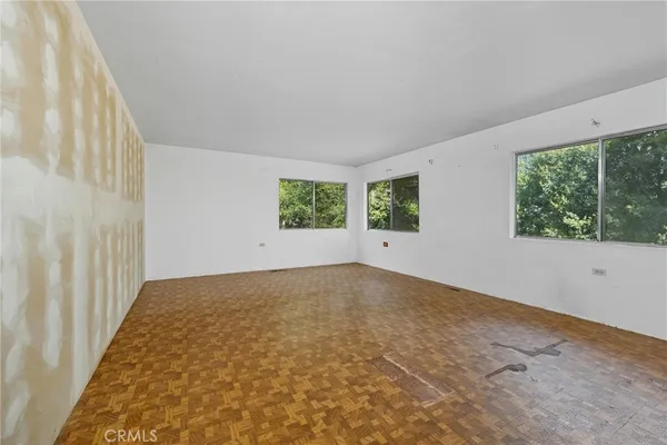 an empty room with windows