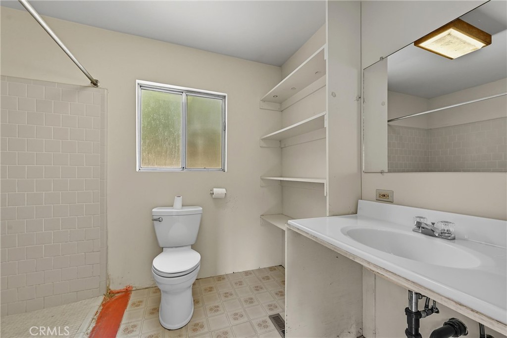 13028 Riata Road Lower Lake, CA 95457 - Photo 17 of 40 a bathroom with a toilet sink and mirror